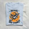 Feral and Spooky Raccoon Halloween T Shirt Light Blue S 1